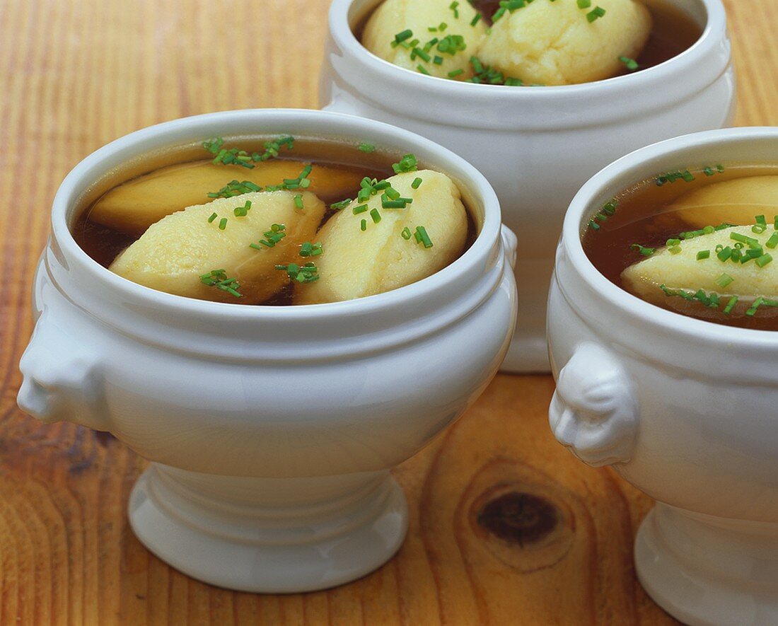 Semolina dumpling soup in soup tureens