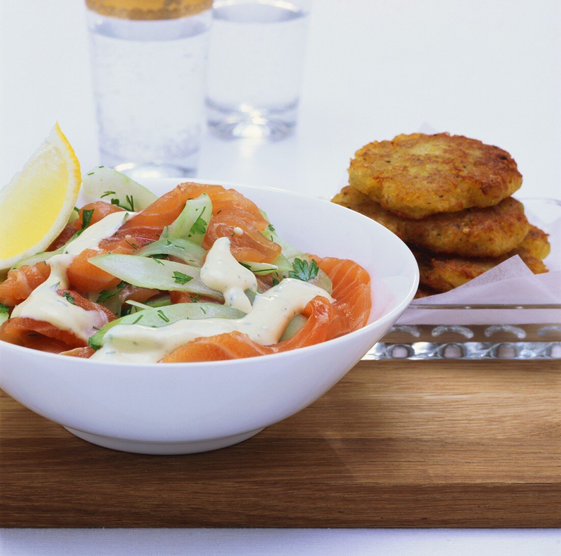 Salmon and cucumber salad, with potato cakes