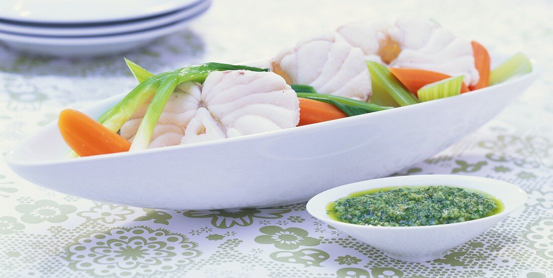 Poached monkfish with green sauce
