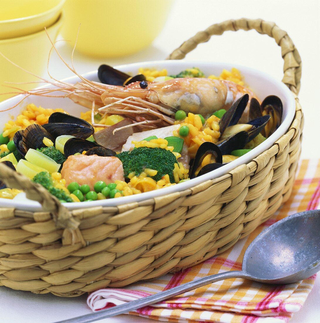 Paella with fish fillet, mussels, prawns and vegetables