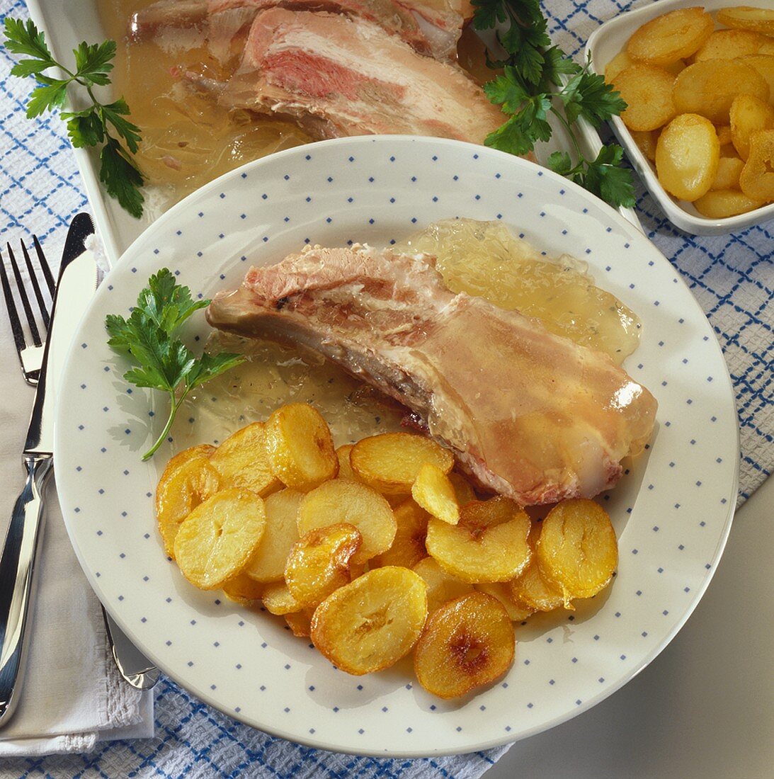 Saure Rippchen (pork ribs in jelly) with fried potatoes