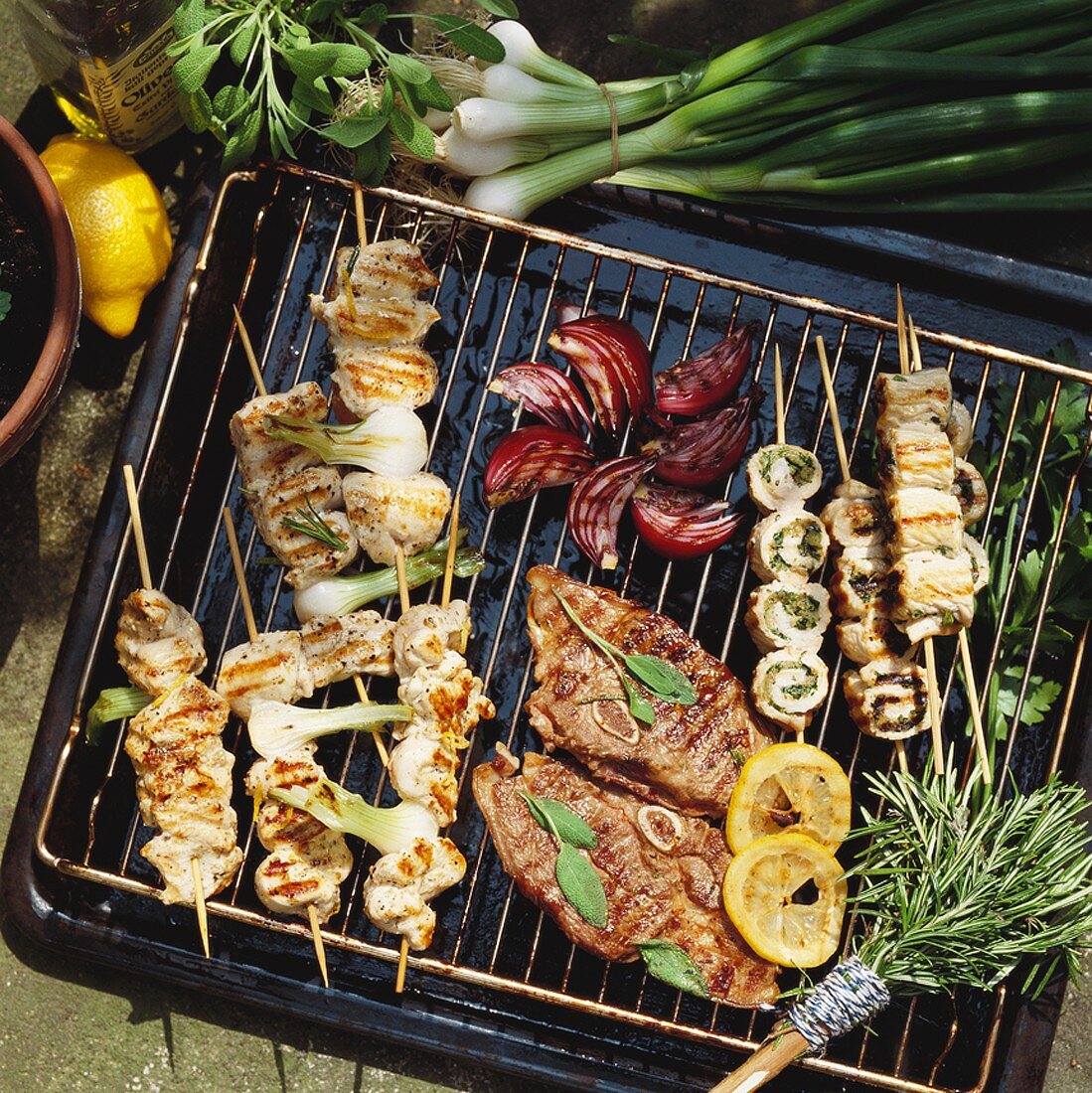 Lamb and various types of kebabs on grill rack