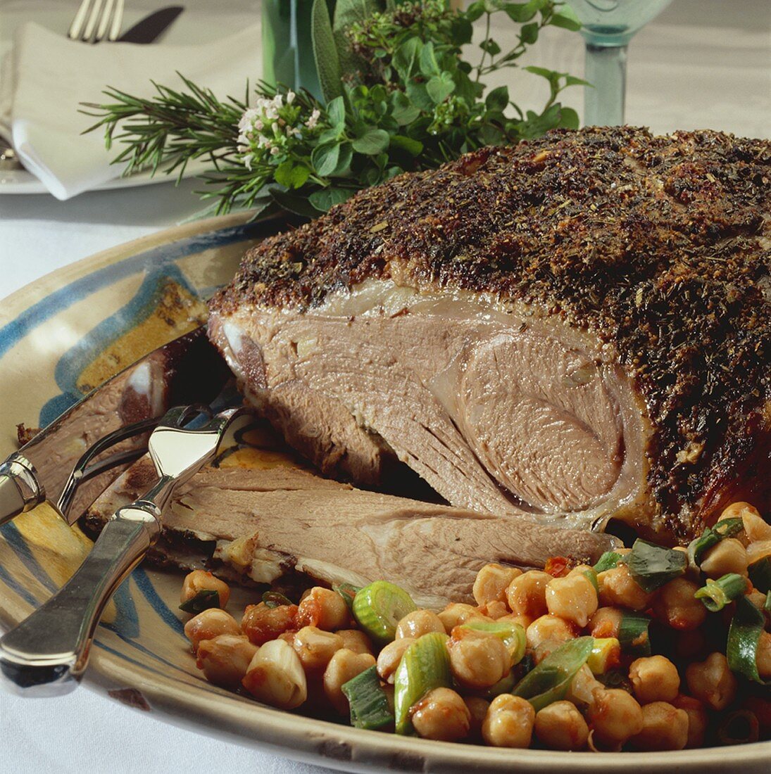 Leg of lamb with crust of herbs & seasonings and chick-peas