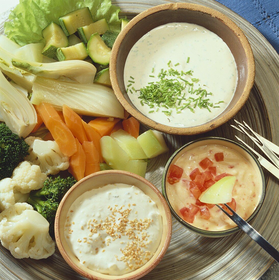 Vegetable fondue with various sauces