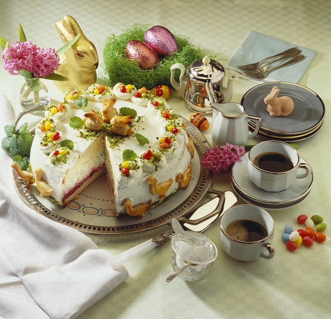Colourful Easter cake with marzipan rabbits
