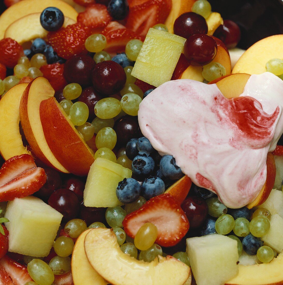 Fruit salad and mascarpone cream with raspberries (detail)