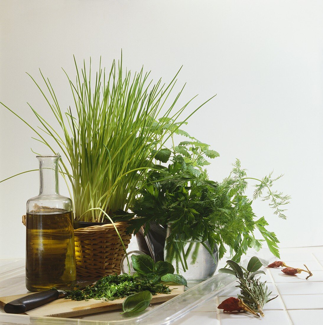 Still life with fresh herbs and olive oil