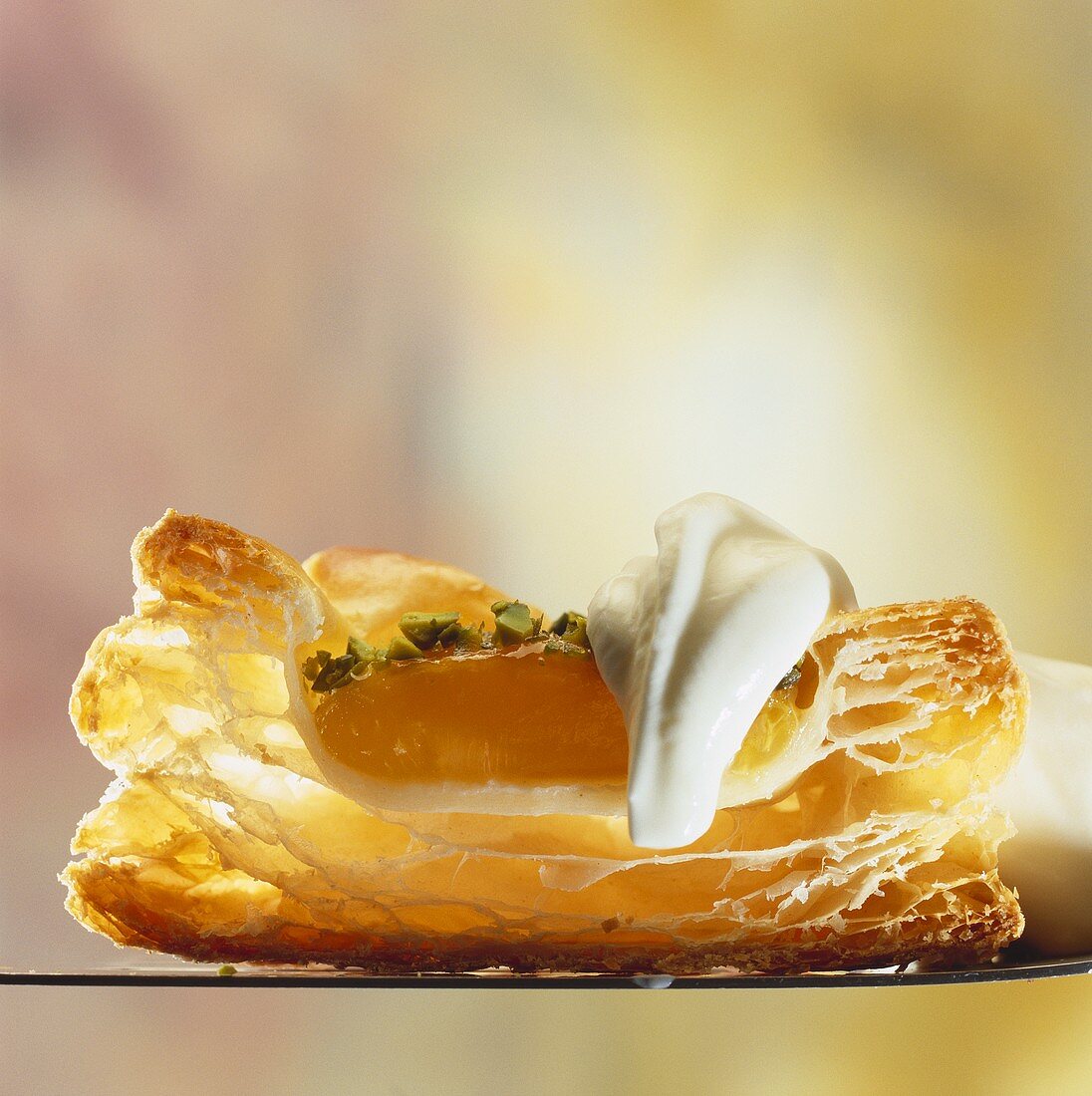 Puff pastry apricot tart with cream (cross-section)