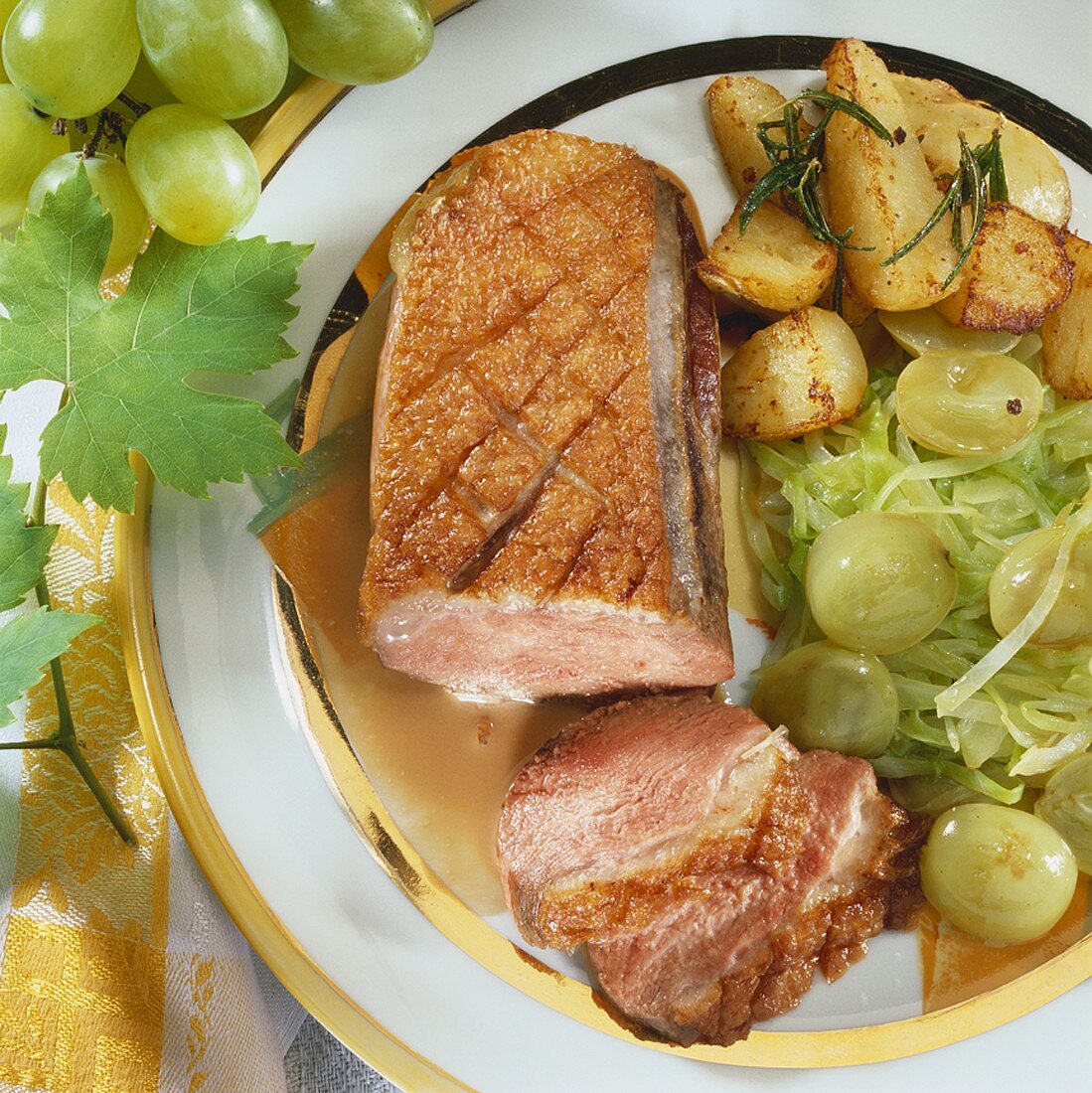 Duck breast with white cabbage & grapes and potatoes