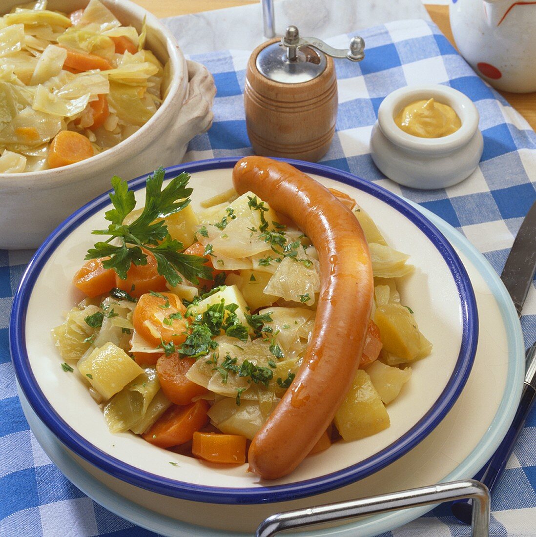 Potato and carrot stew with frankfurter