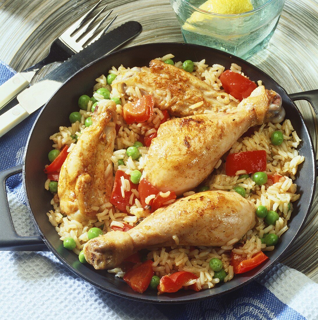 Fried chicken legs on vegetable rice
