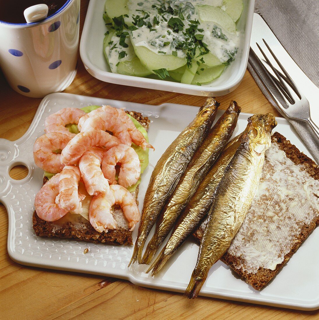 Fisherman's breakfast: shrimps and fish on black bread
