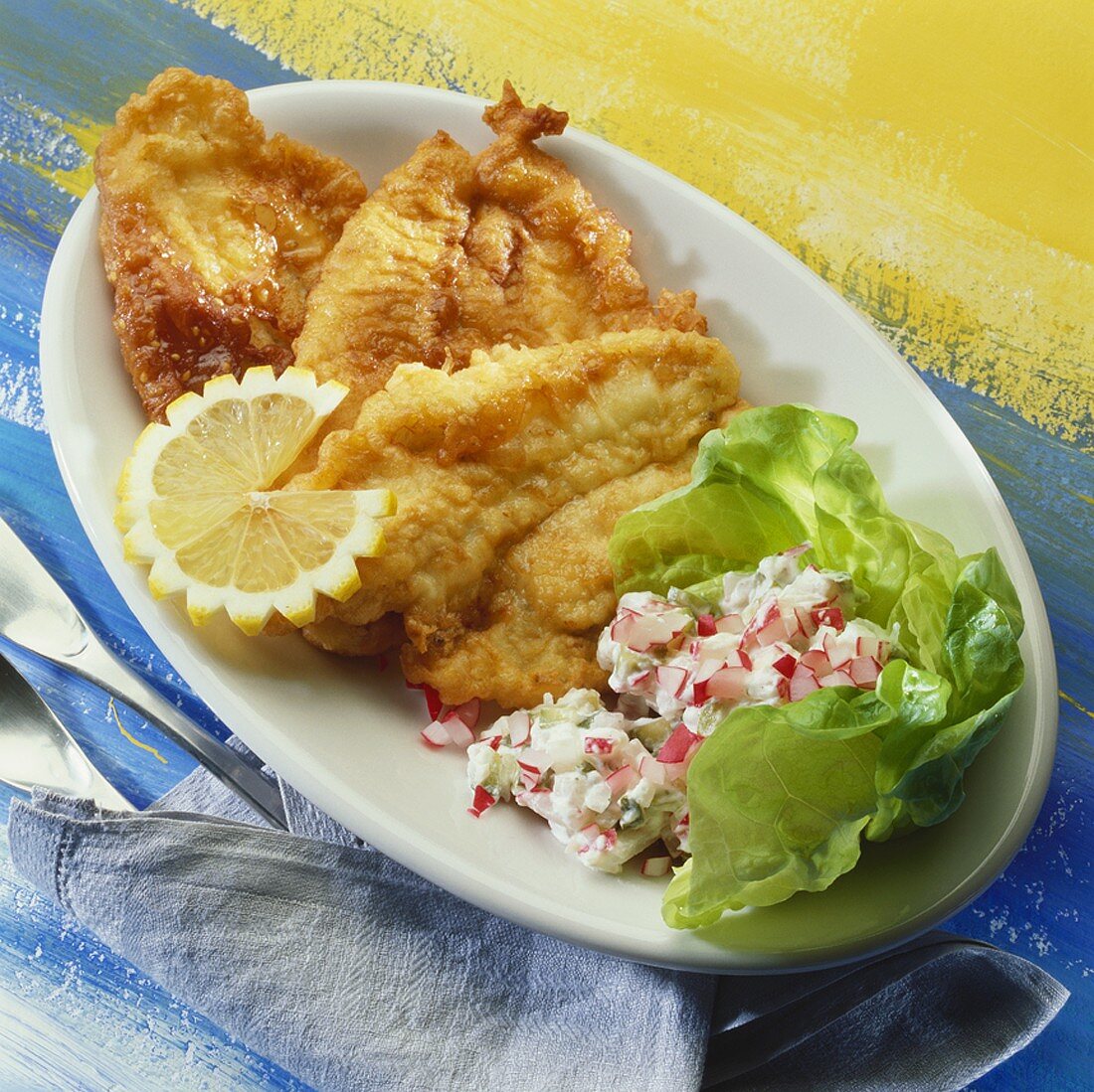 Plaice fillets in wine batter with radish salad