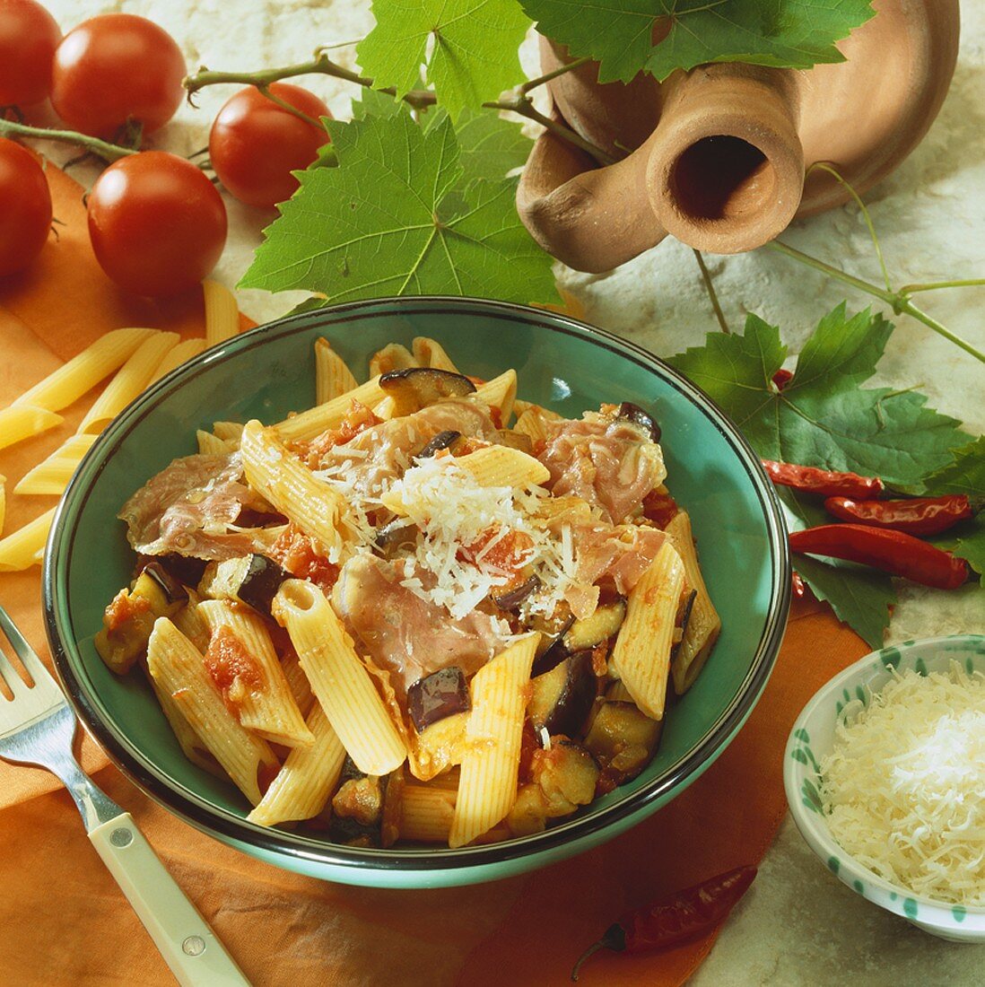 Penne all'arrabbiata with aubergines and ham