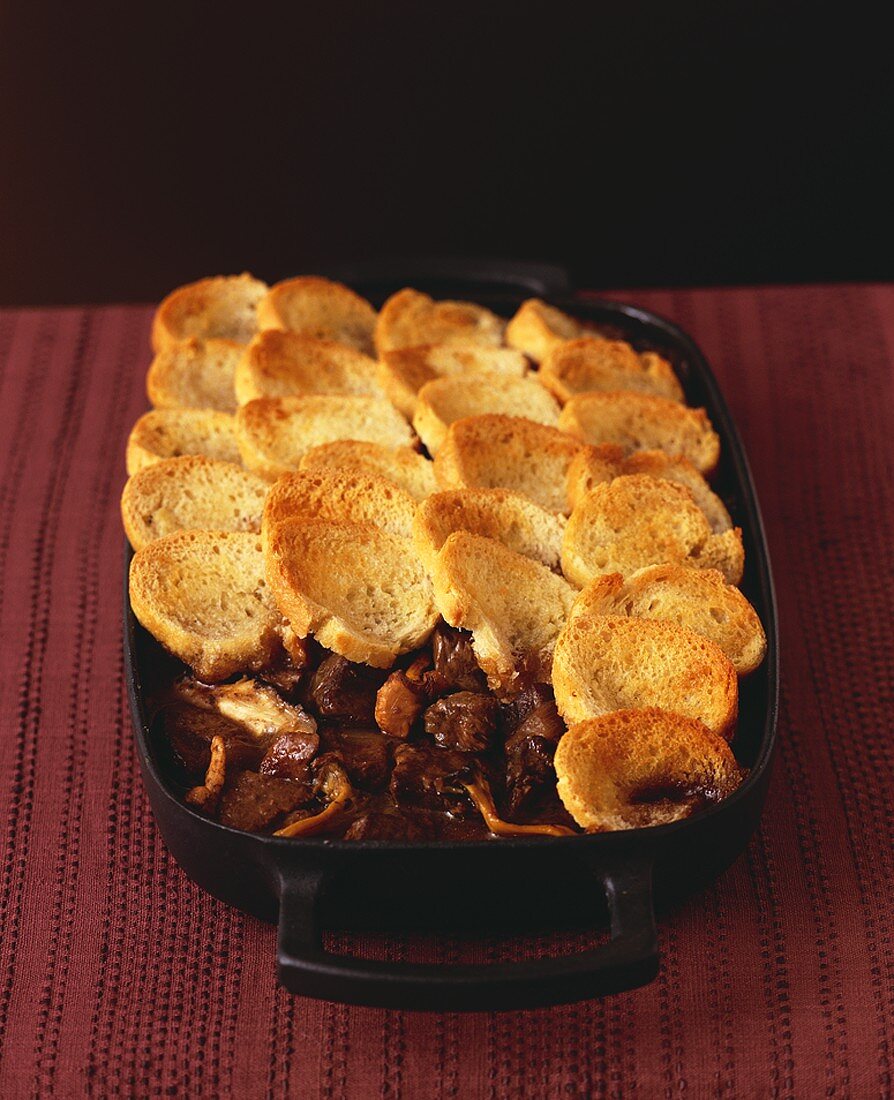 Beef and mushroom ragout with toasted bread topping