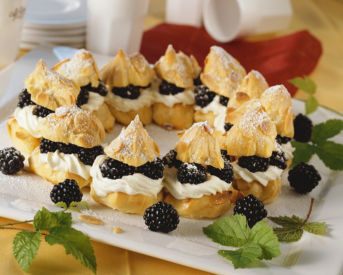 Profiteroles with blackberry and cream filling