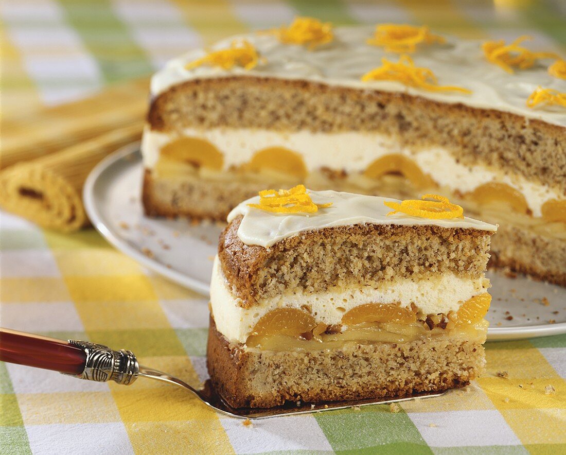 Hazelnut cake with apple, apricot and cream filling
