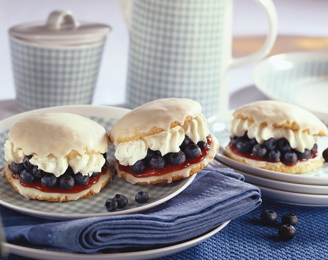 Filled blueberry cakes with white chocolate icing