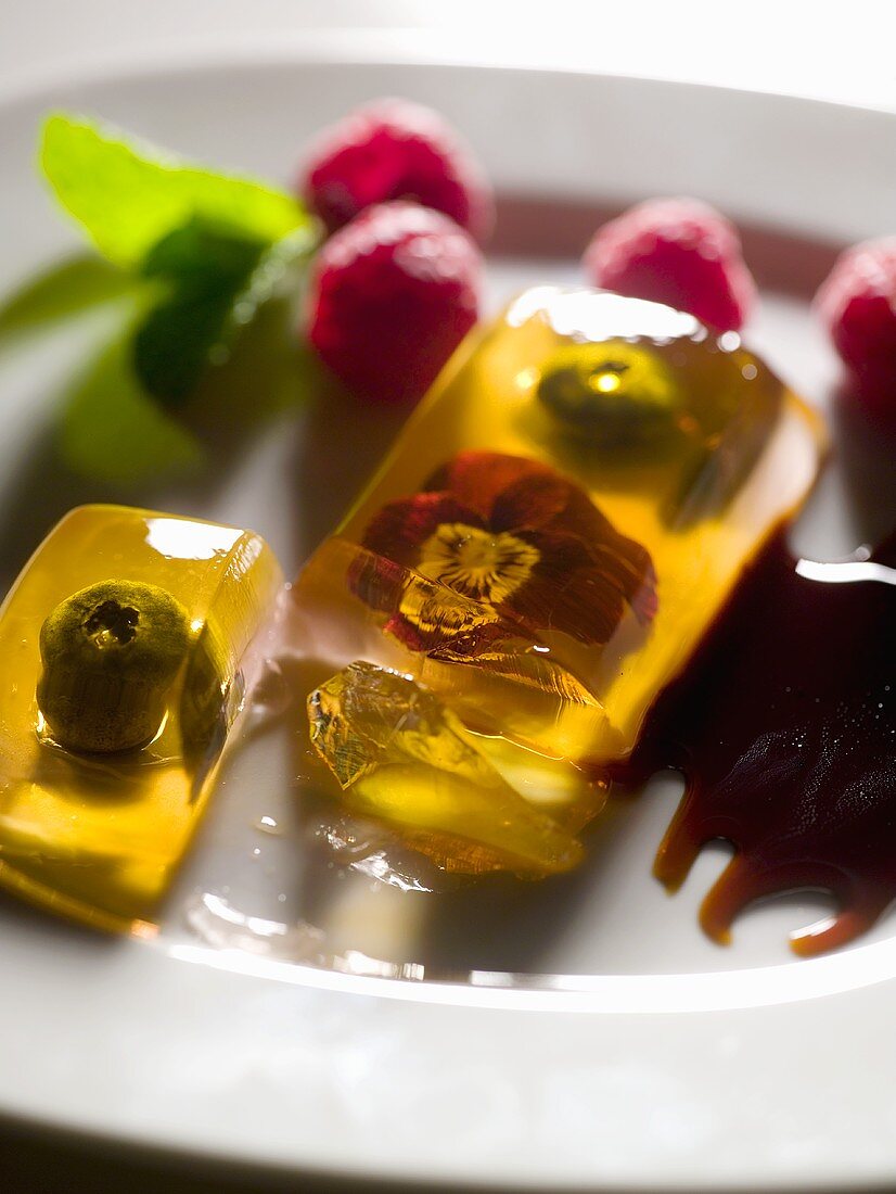 Berries and edible flowers in aspic