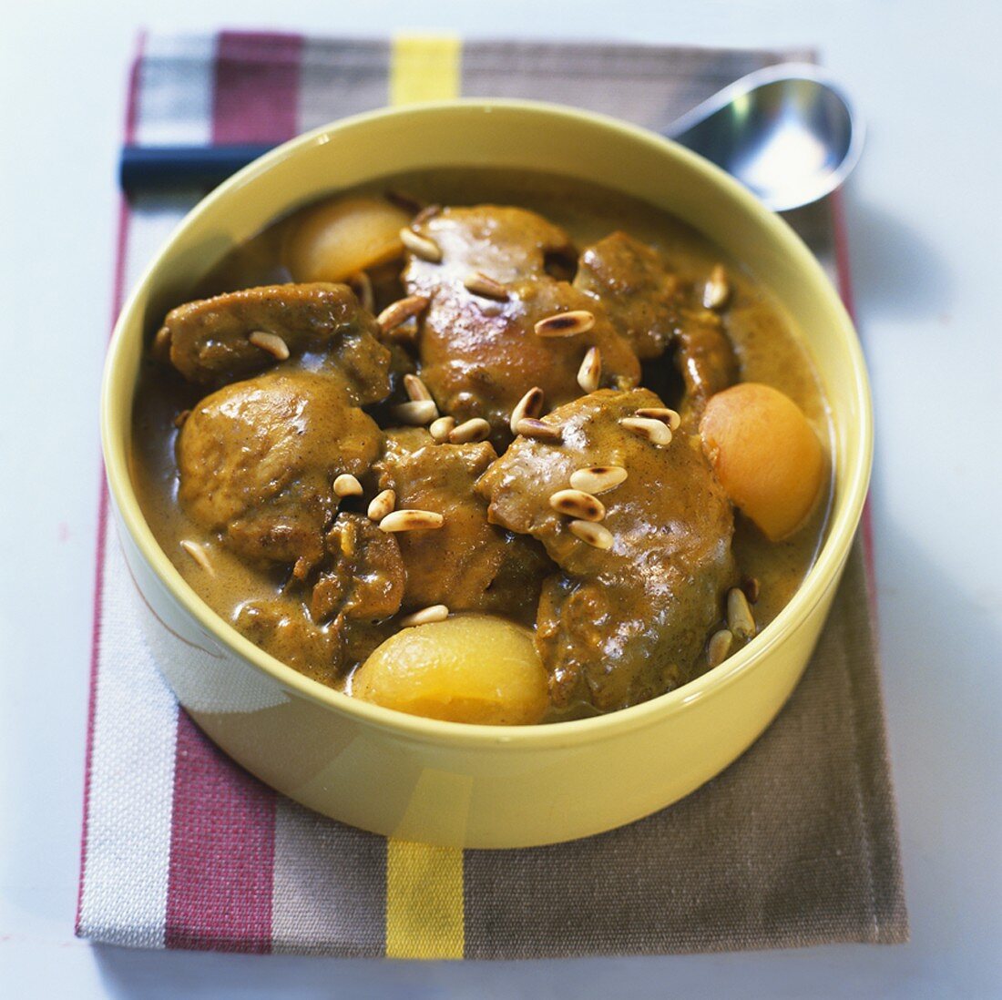 Curried chicken with apricots and pine nuts