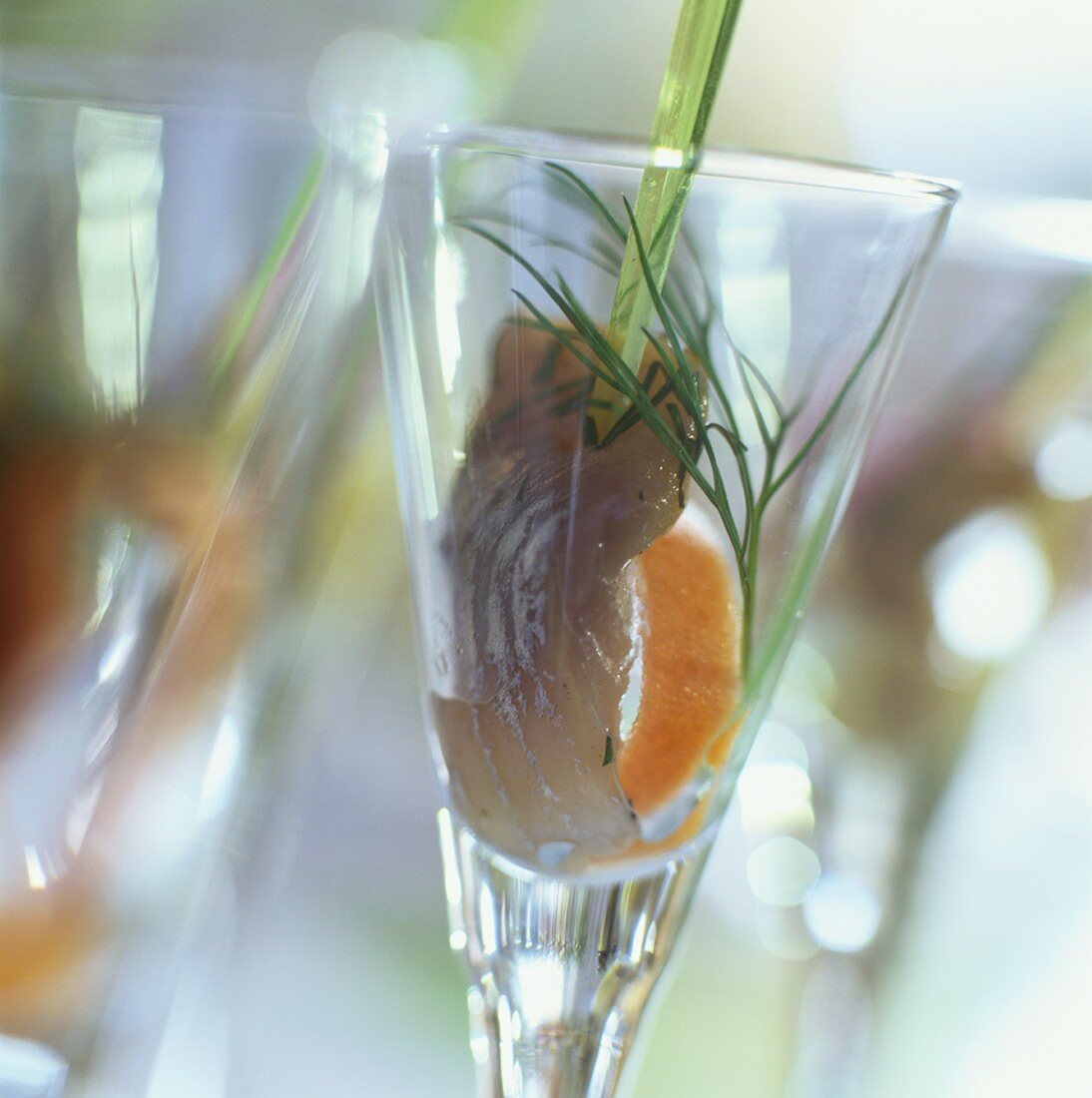 Marinated herring with dill, served in a glass