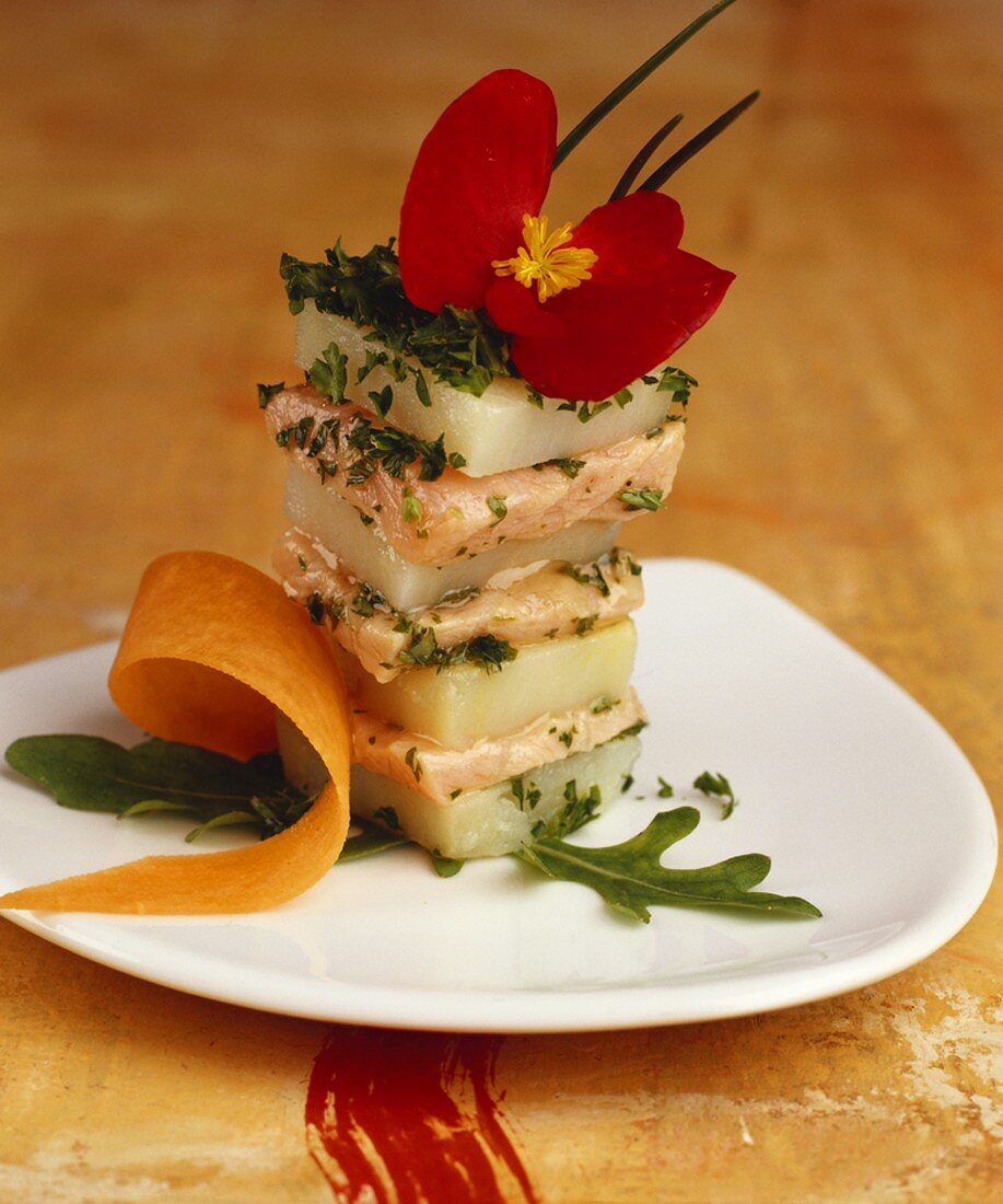 Tower of salmon and potato with fresh herbs