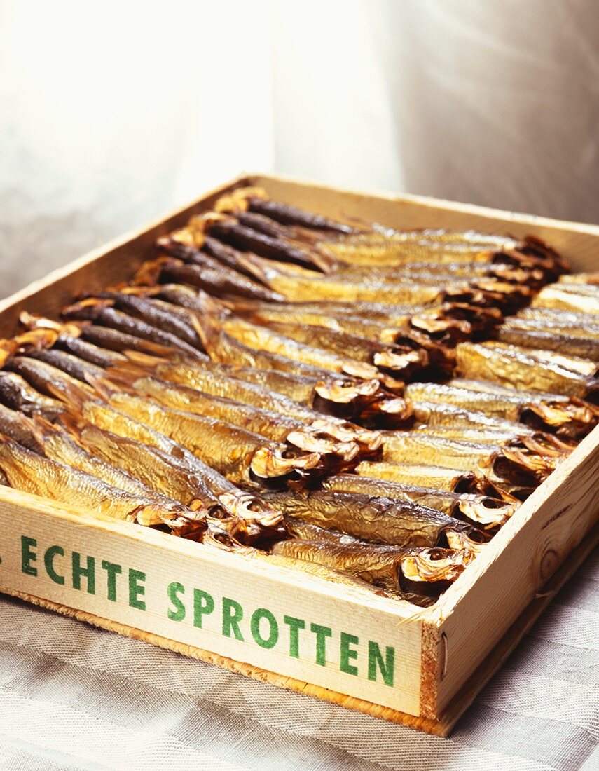 Smoked sprats in wooden box