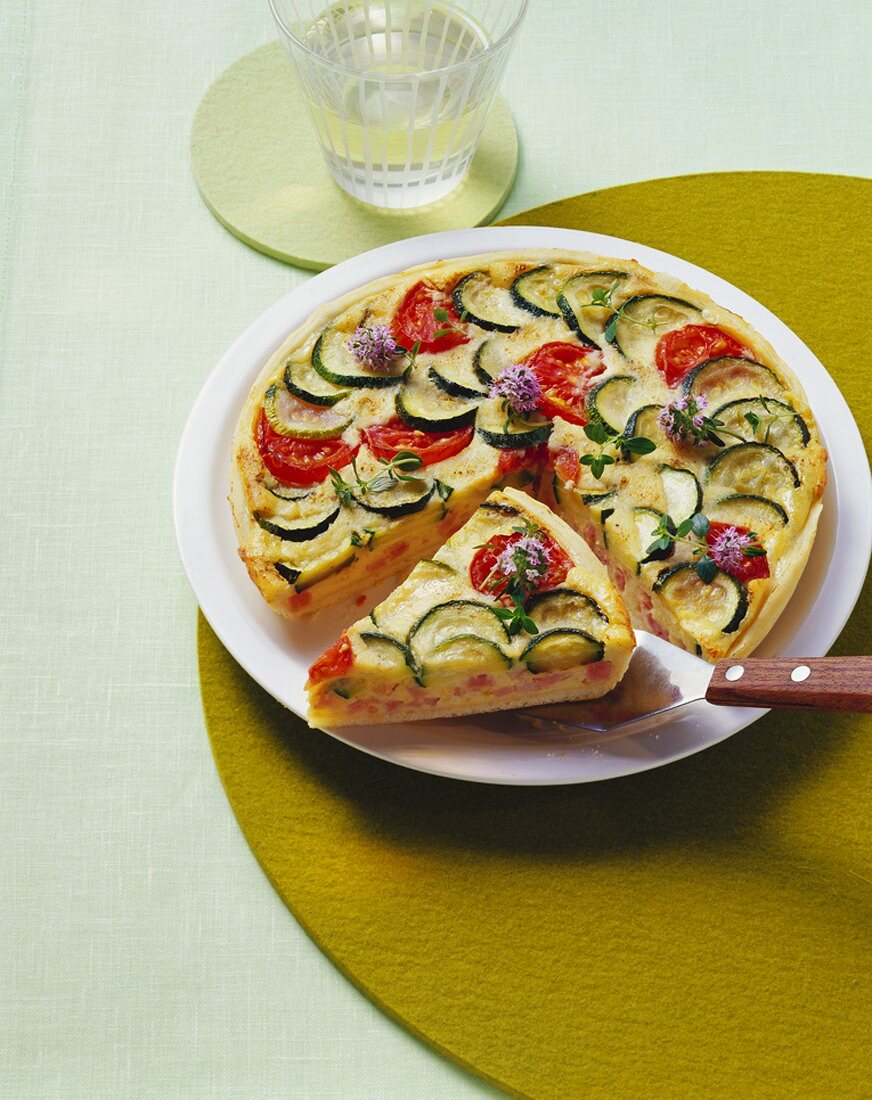 Courgette tart, partly sliced