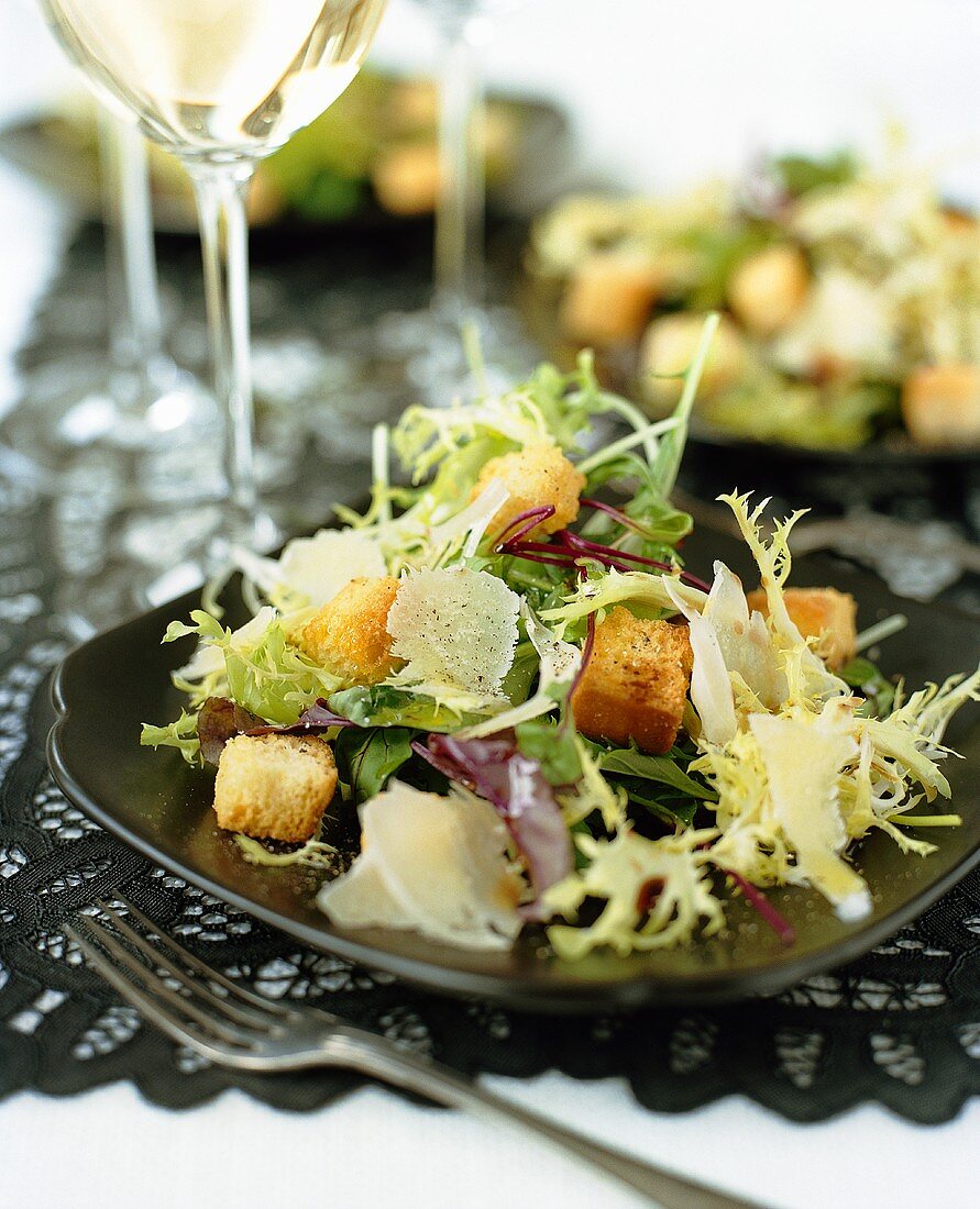 Mixed green salad with Parmesan and croutons