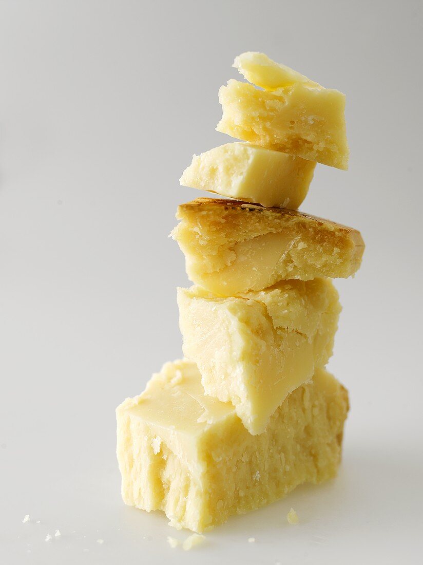 Pieces of Parmesan, in a pile