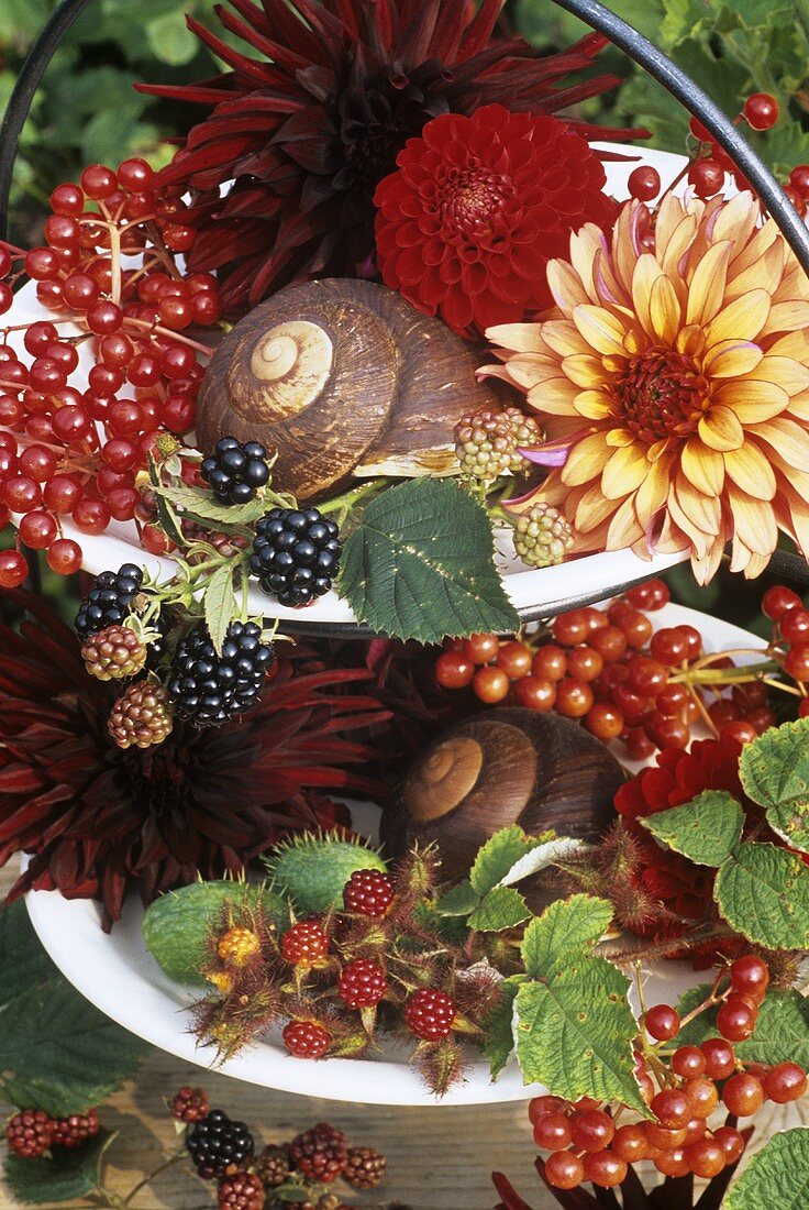 Dahlias, berries and fruit on tiered stand