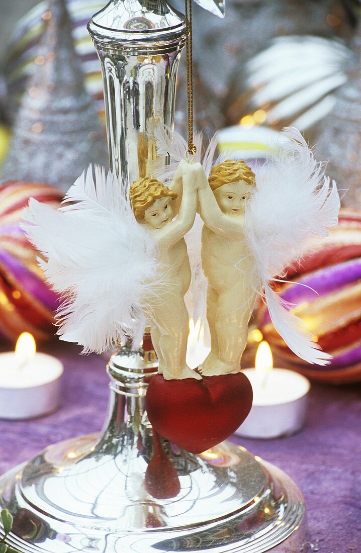 Angel hanger hanging on a candlestick
