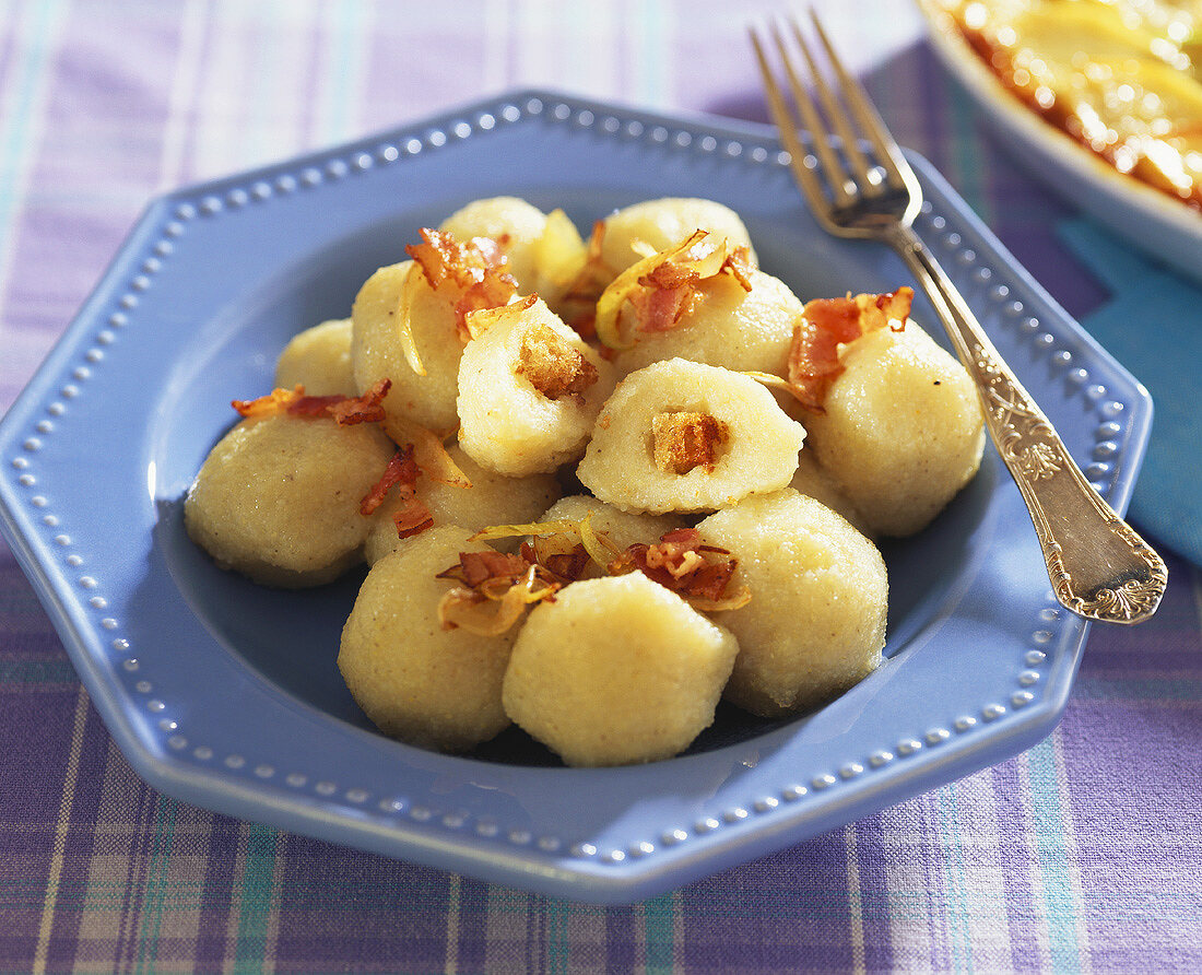 Pyzy (Polish potato dumplings) filled with bacon