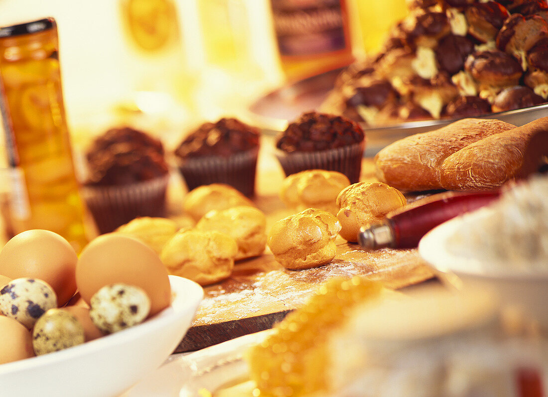 Profiteroles, muffins, eggs and rolls for buffet