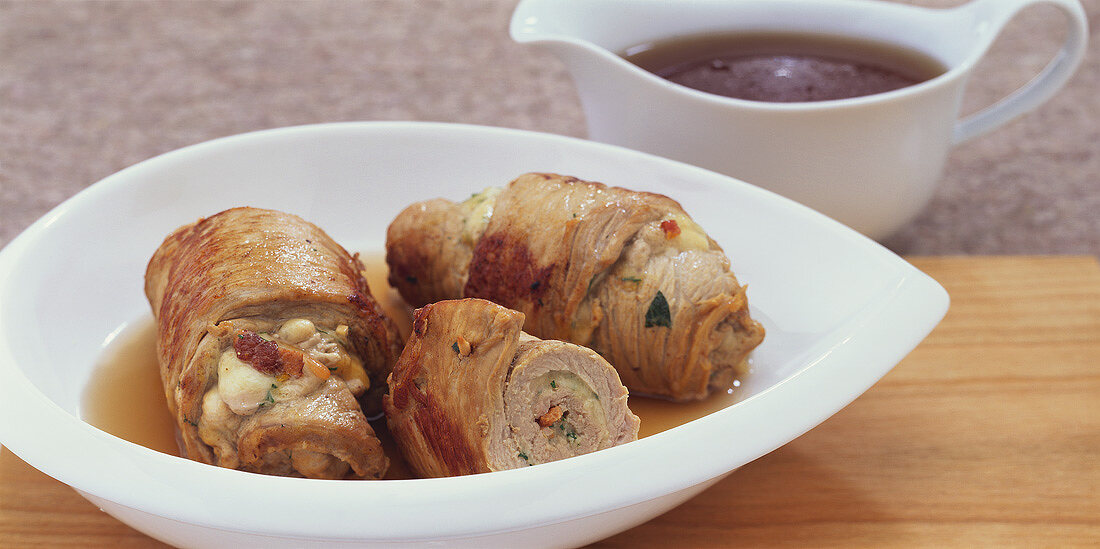 Veal rolls stuffed with mozzarella, bacon and pine nuts