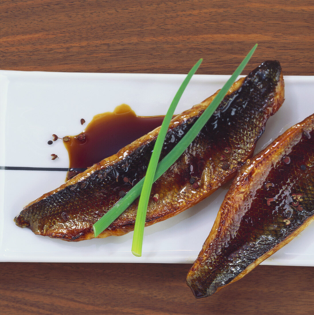 Grilled fish fillets in teriyaki marinade