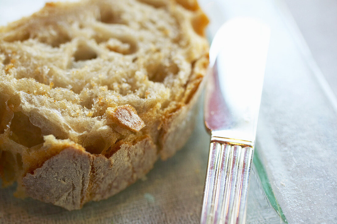 A slice of white bread with knife