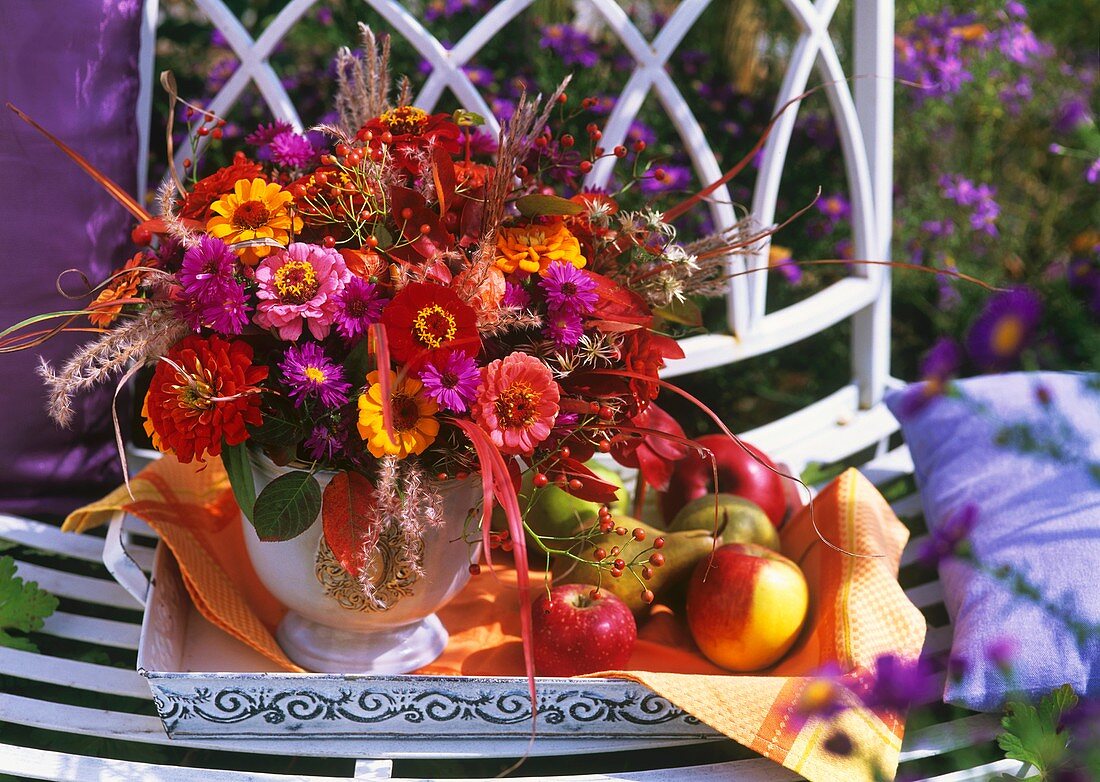 Vase of zinnias, asters, Chinese silvergrass & switchgrass