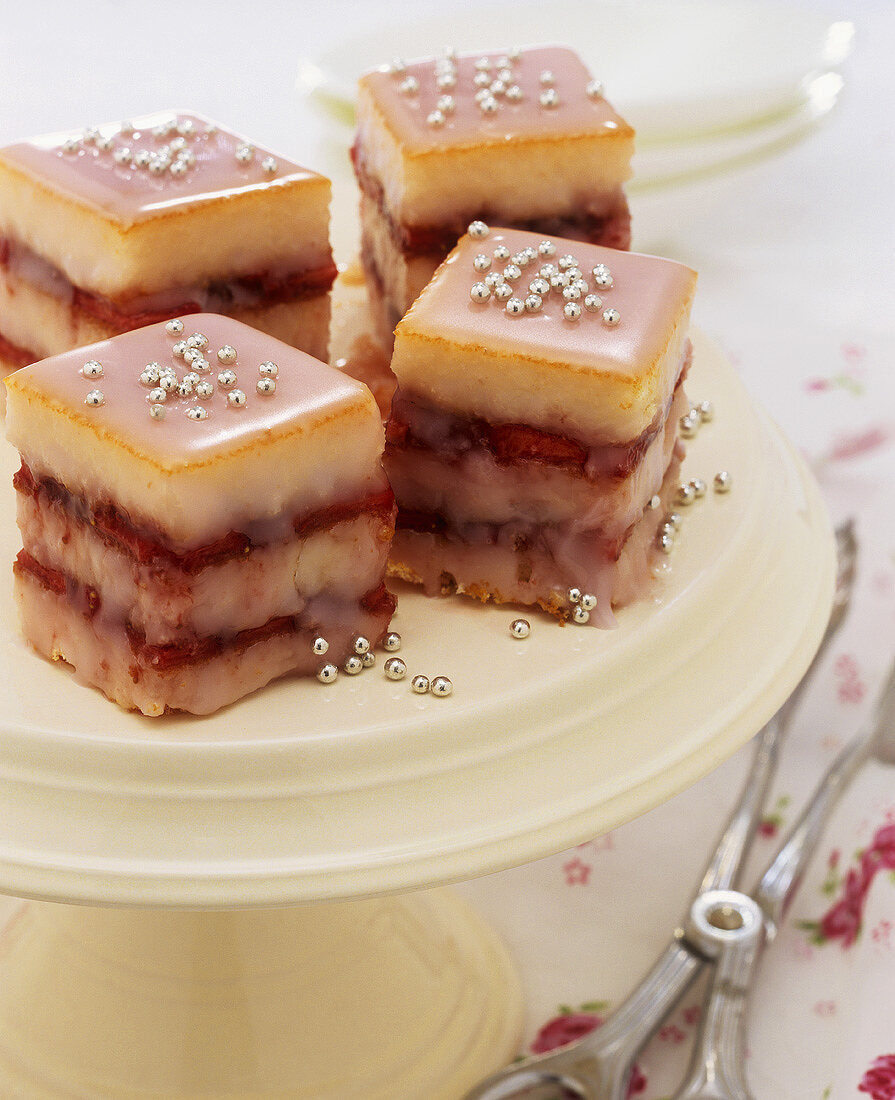 Petit fours with pink icing and silver dragées