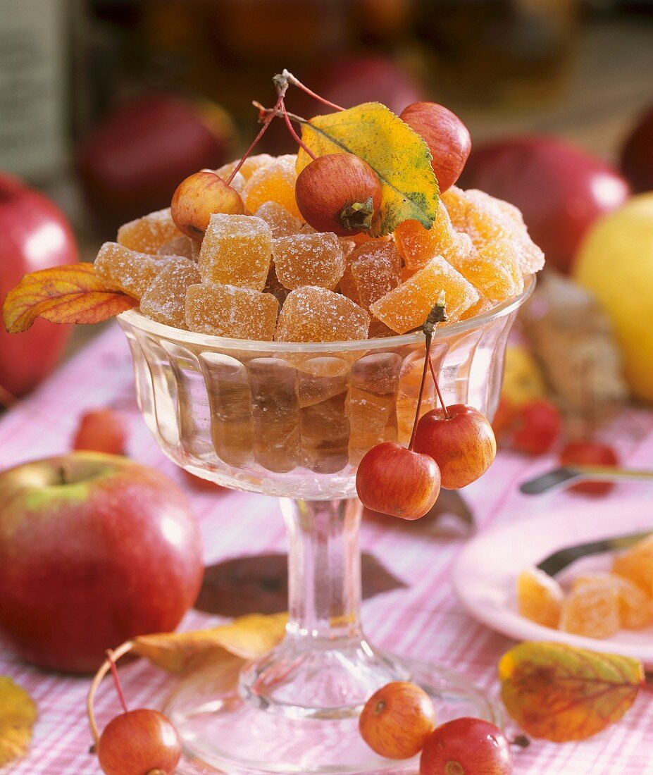 Pieces of sugared apple jelly in stemmed glass bowl