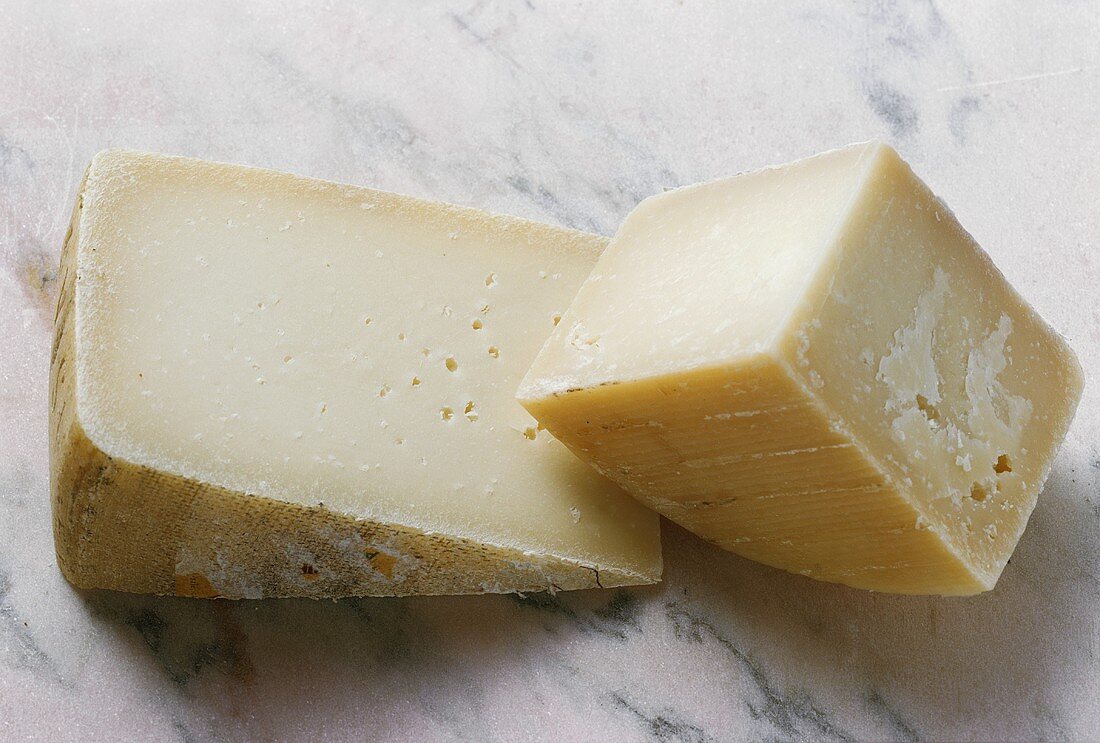 Two Italian cheeses: Pecorino and Asiago