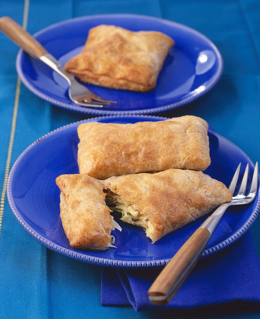 Puff pastry pasties filled with leek and feta cheese