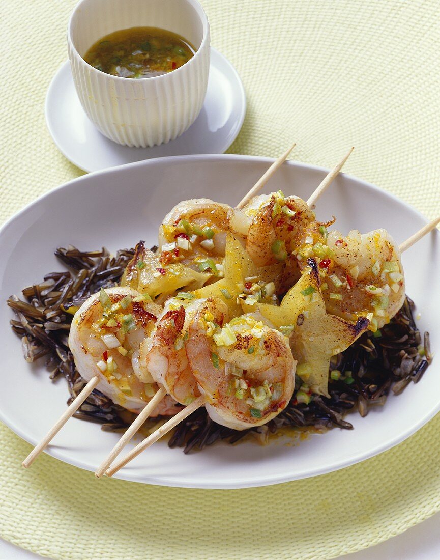 Prawn and carambola skewers with chilli and wild rice