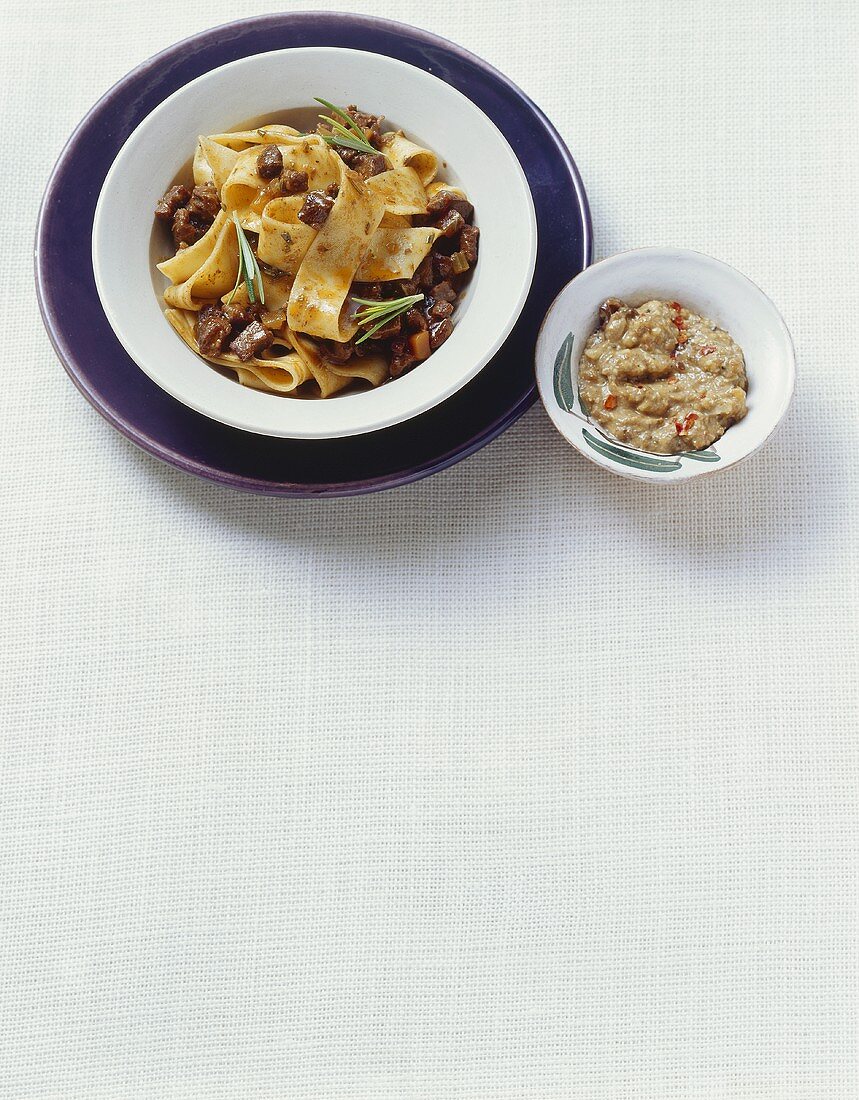Ribbon pasta with wild boar sauce and cep pesto (Italy)