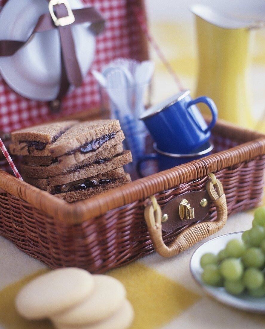 Peanut butter and jelly sandwiches in picnic basket