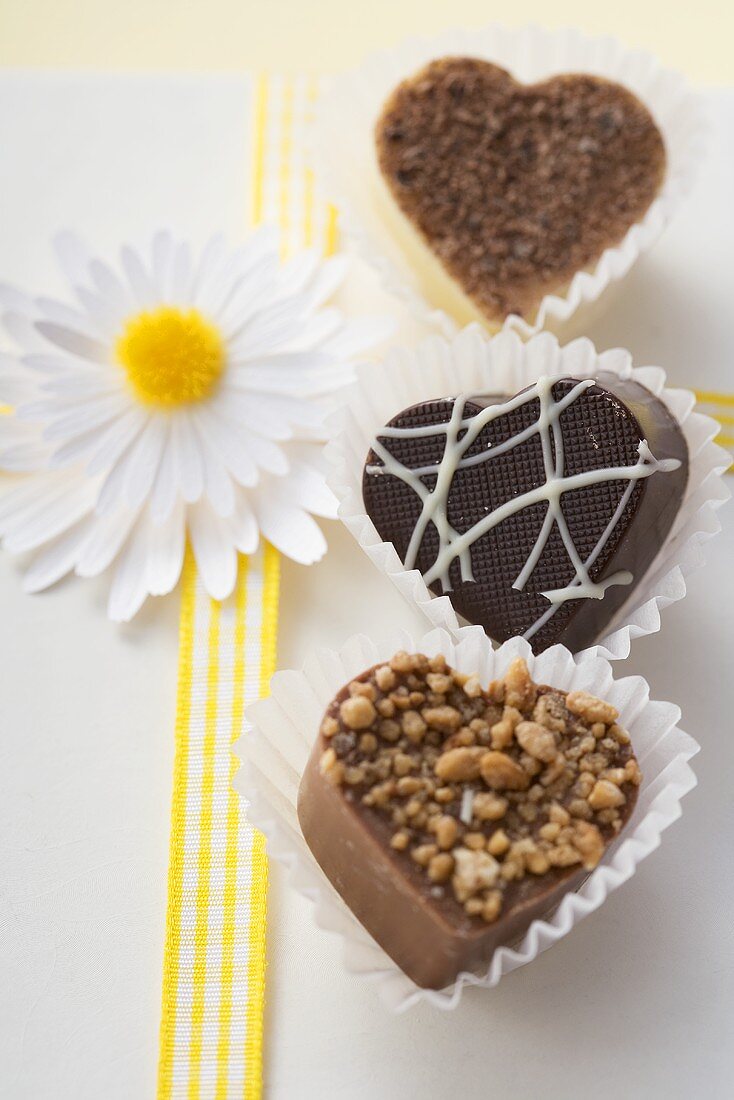 Three heart-shaped chocolates