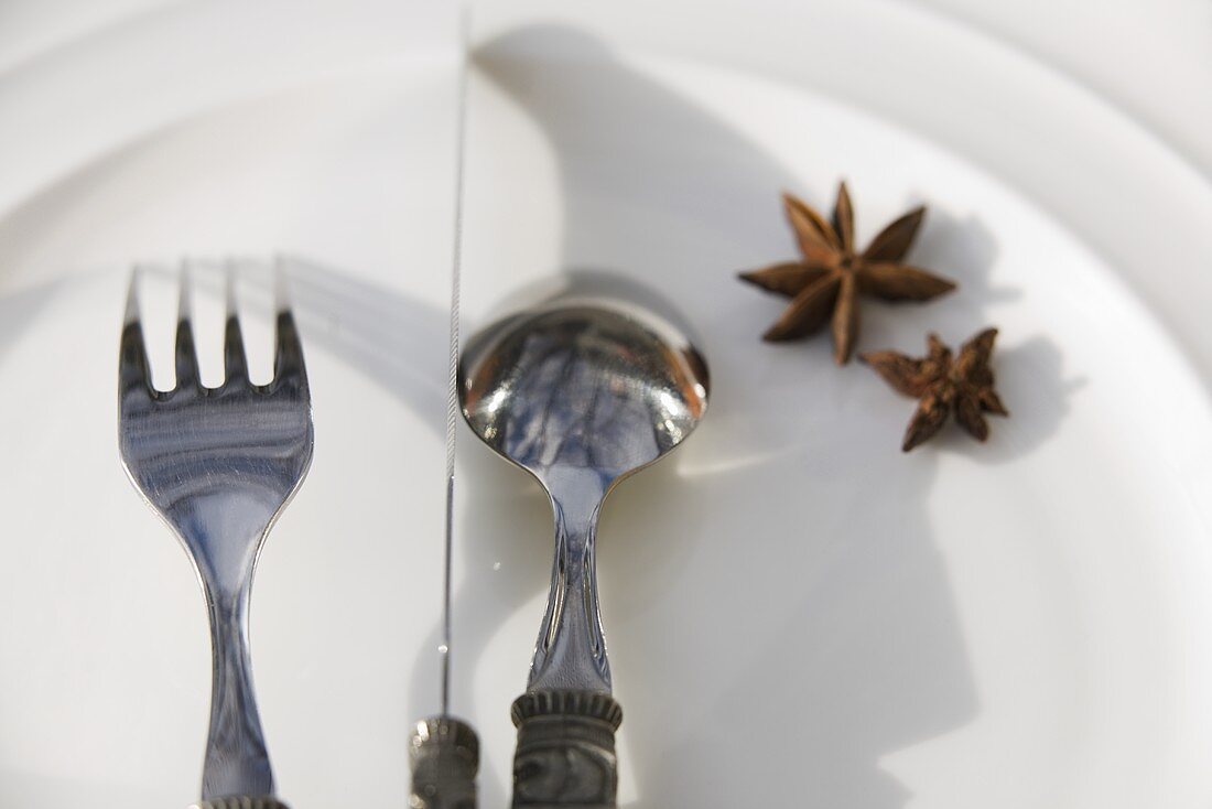 A place-setting with star anise on a plate