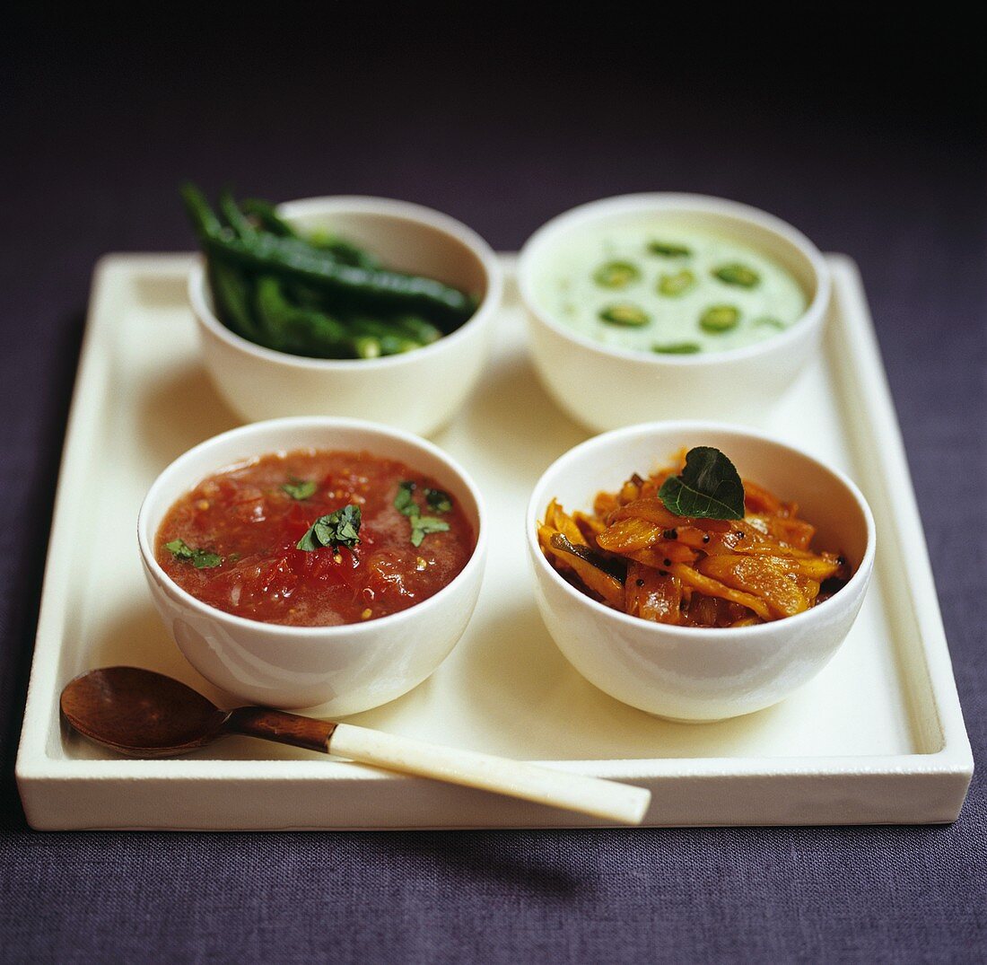 Four different sauces and chutneys