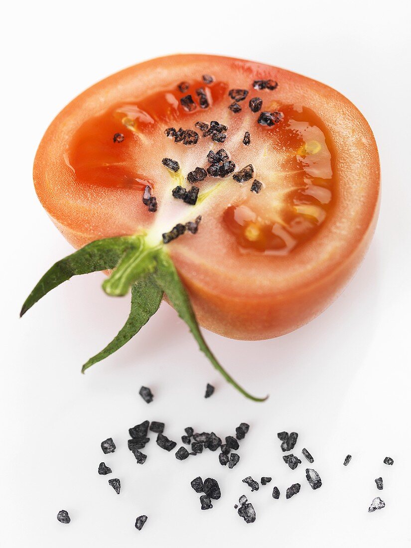 Black Hawaiian salt on half a tomato