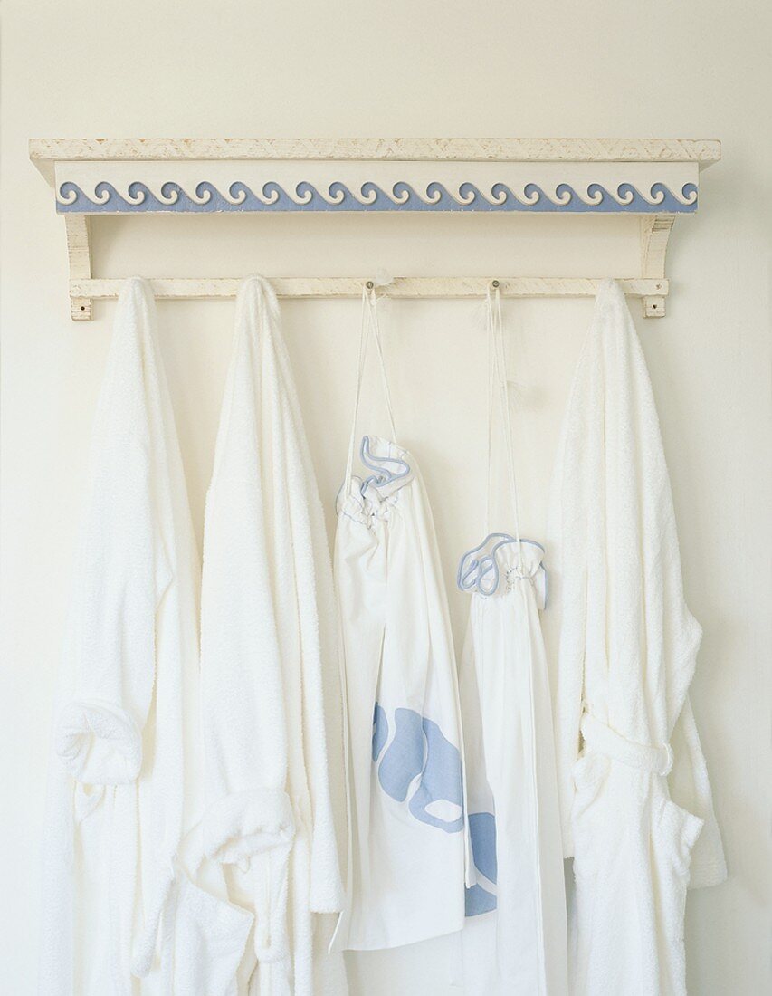 Dressing gowns hanging on hooks